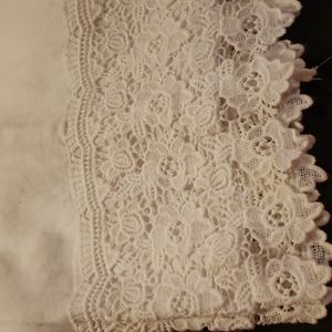 100% white linen pant with elastic waist, 2 side slit pockets, & 2 back pockets.